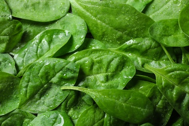 Fresh green healthy spinach as background, closeup