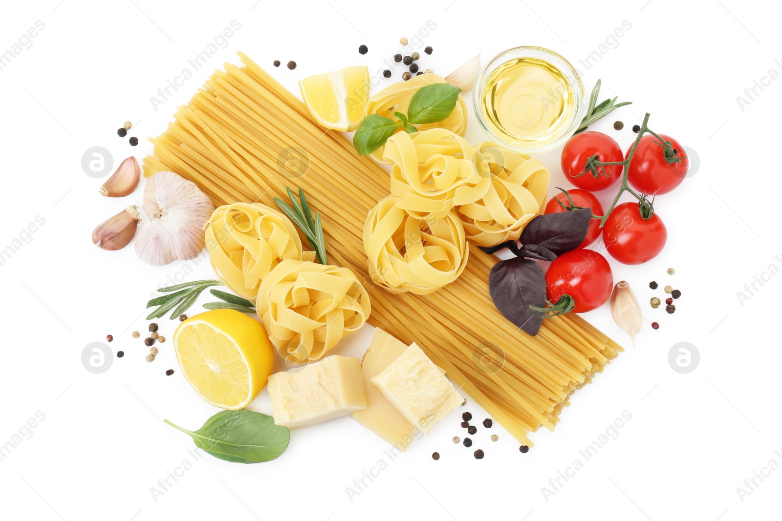 Photo of Different types of pasta and ingredients on white background, top view