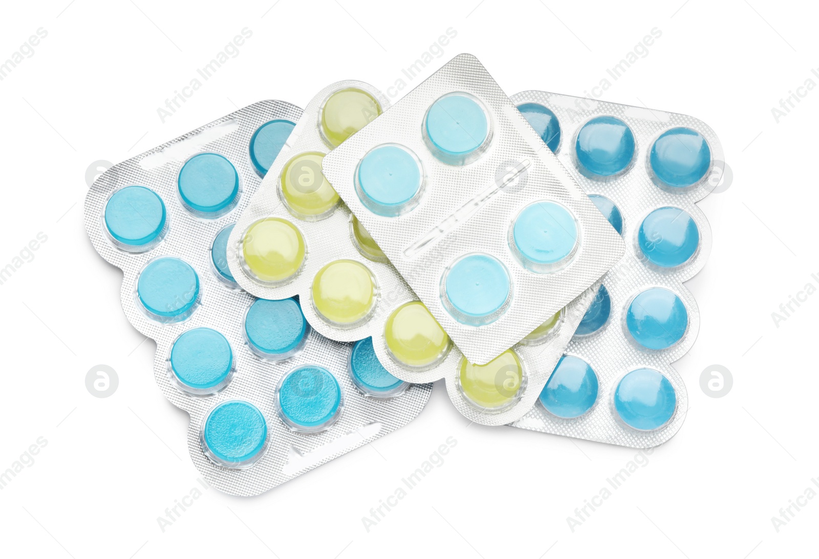 Photo of Blisters with colorful cough drops on white background, top view