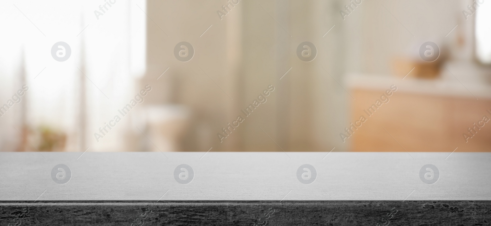 Image of Empty table and blurred view of stylish bathroom interior