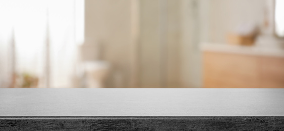 Image of Empty table and blurred view of stylish bathroom interior