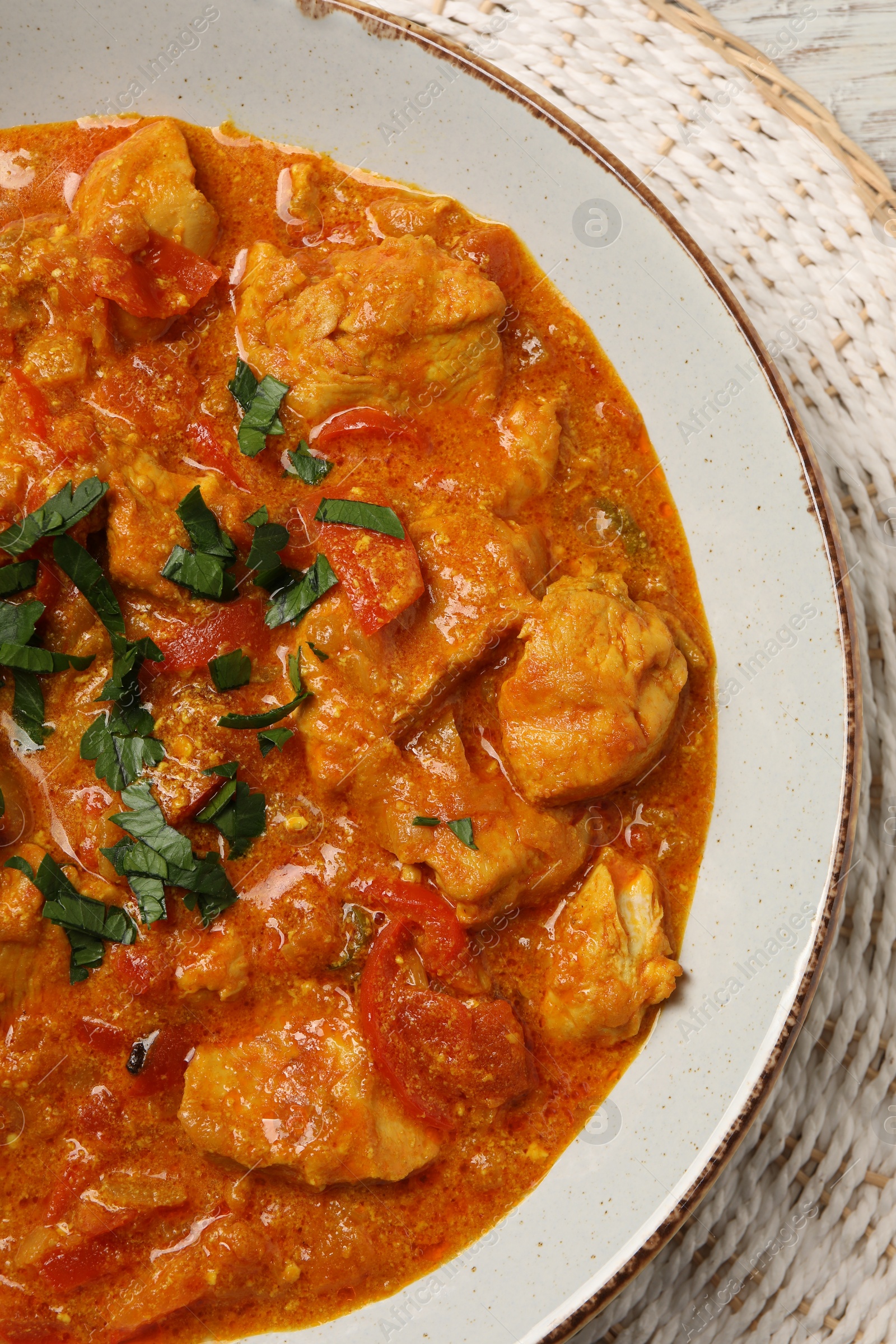 Photo of Delicious chicken curry on table, top view