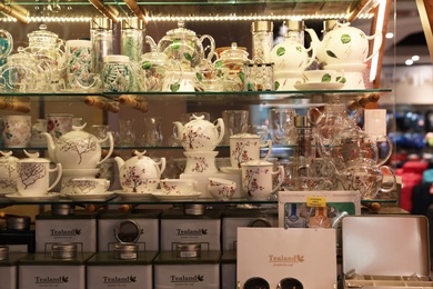 Photo of DUBAI, UNITED ARAB EMIRATES - NOVEMBER 04, 2018: Show glass with tea ware in shopping mall