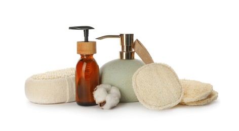 Photo of Set of toiletries with natural loofah sponges on white background