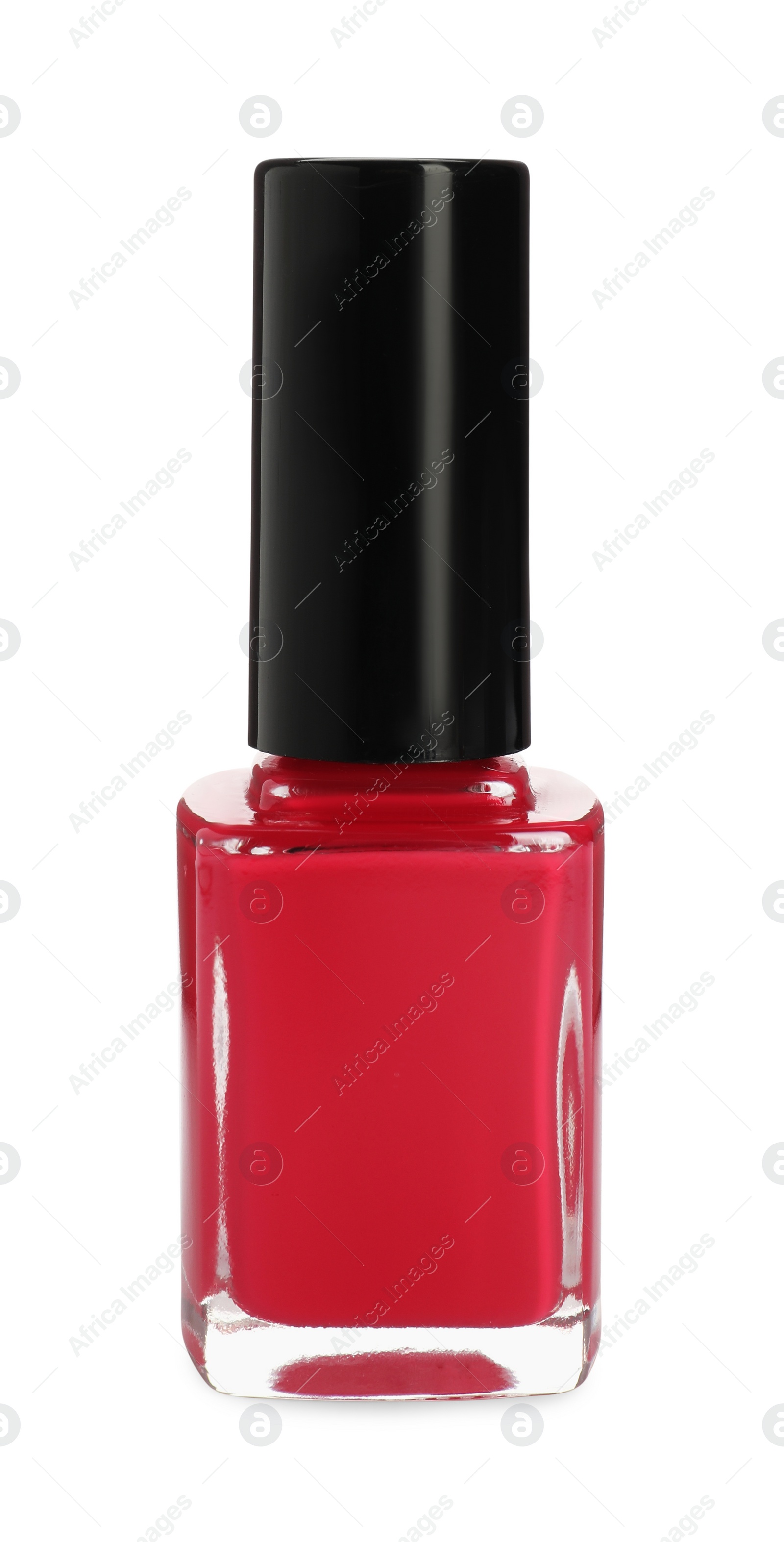 Photo of Red nail polish in bottle isolated on white