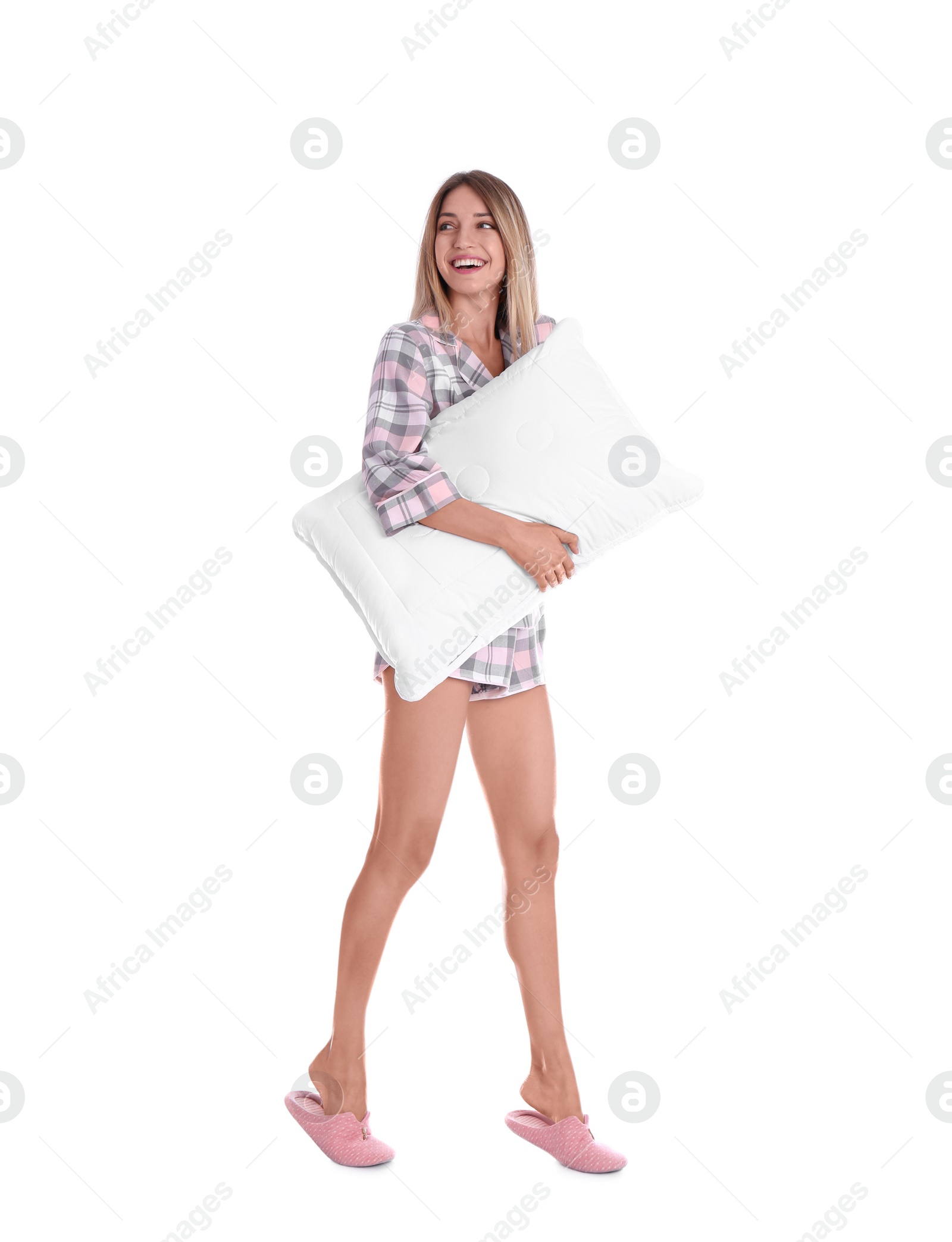 Photo of Happy woman in pajamas with pillow on white background