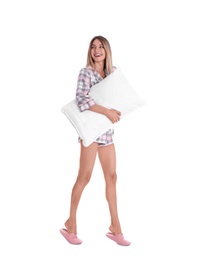 Happy woman in pajamas with pillow on white background