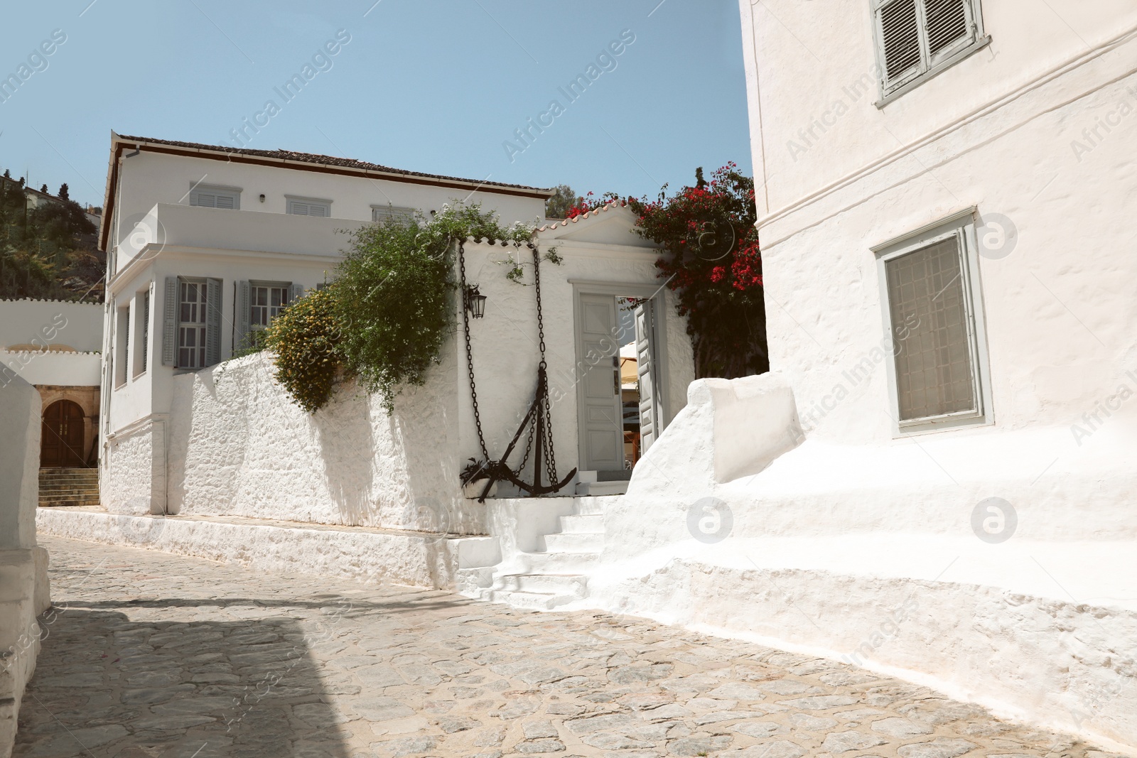 Photo of City street with beautiful buildings on sunny day