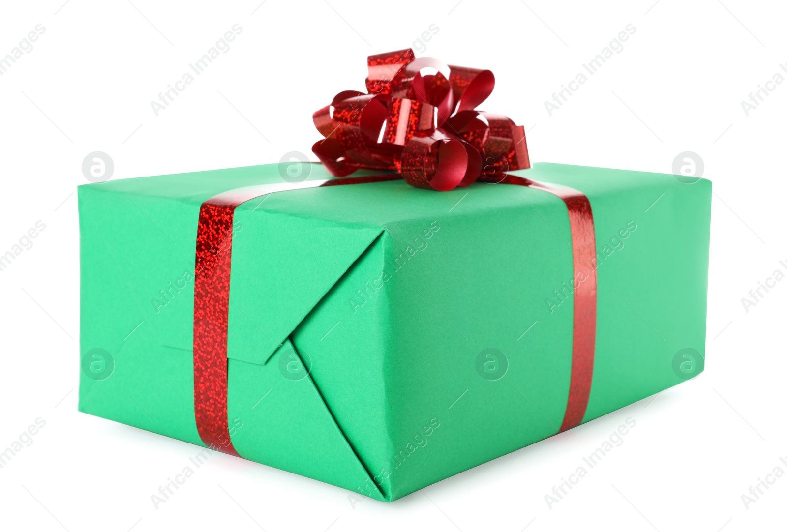 Photo of Christmas gift box decorated with ribbon bow on white background