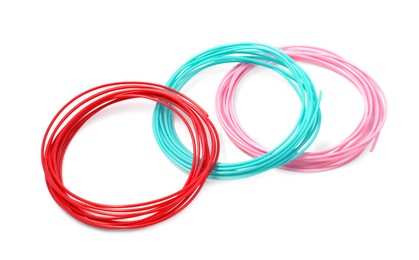 Photo of Colorful plastic filaments for 3D pen on white background