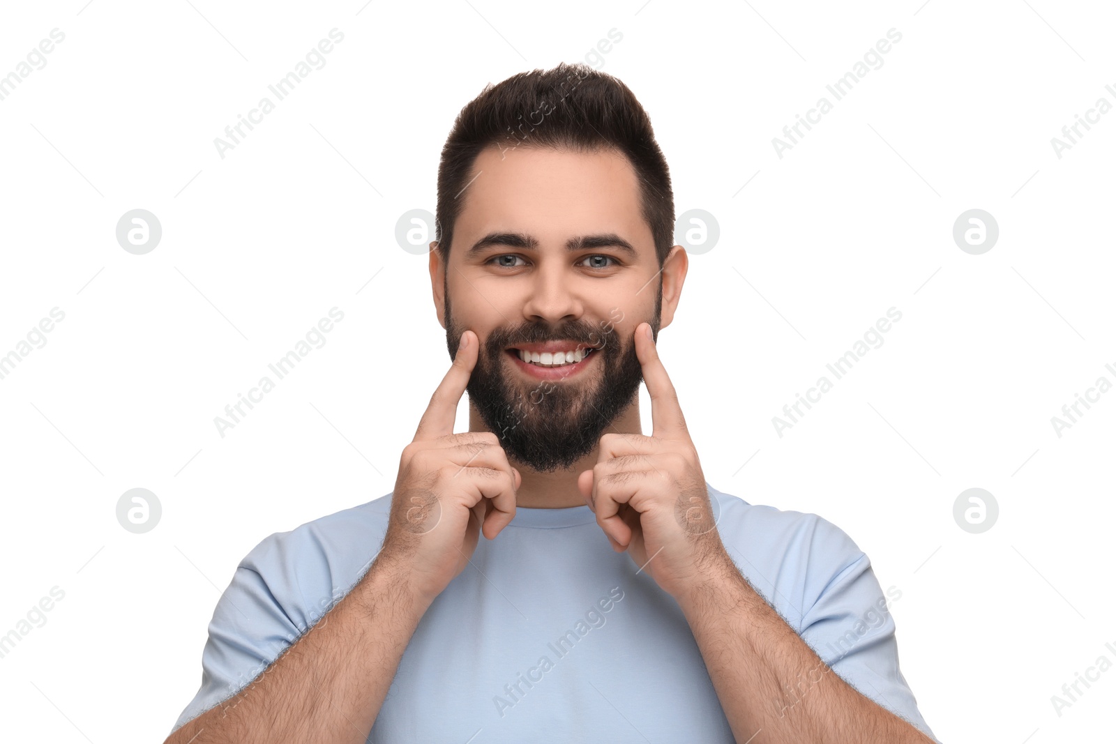 Photo of Man showing his clean teeth and smiling on white background