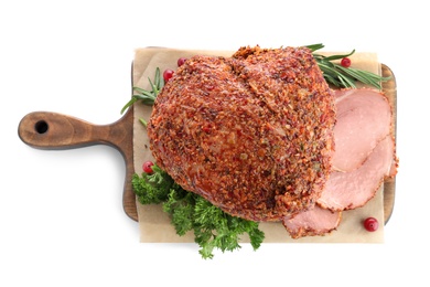 Wooden board with homemade delicious ham on white background, top view. Festive dinner