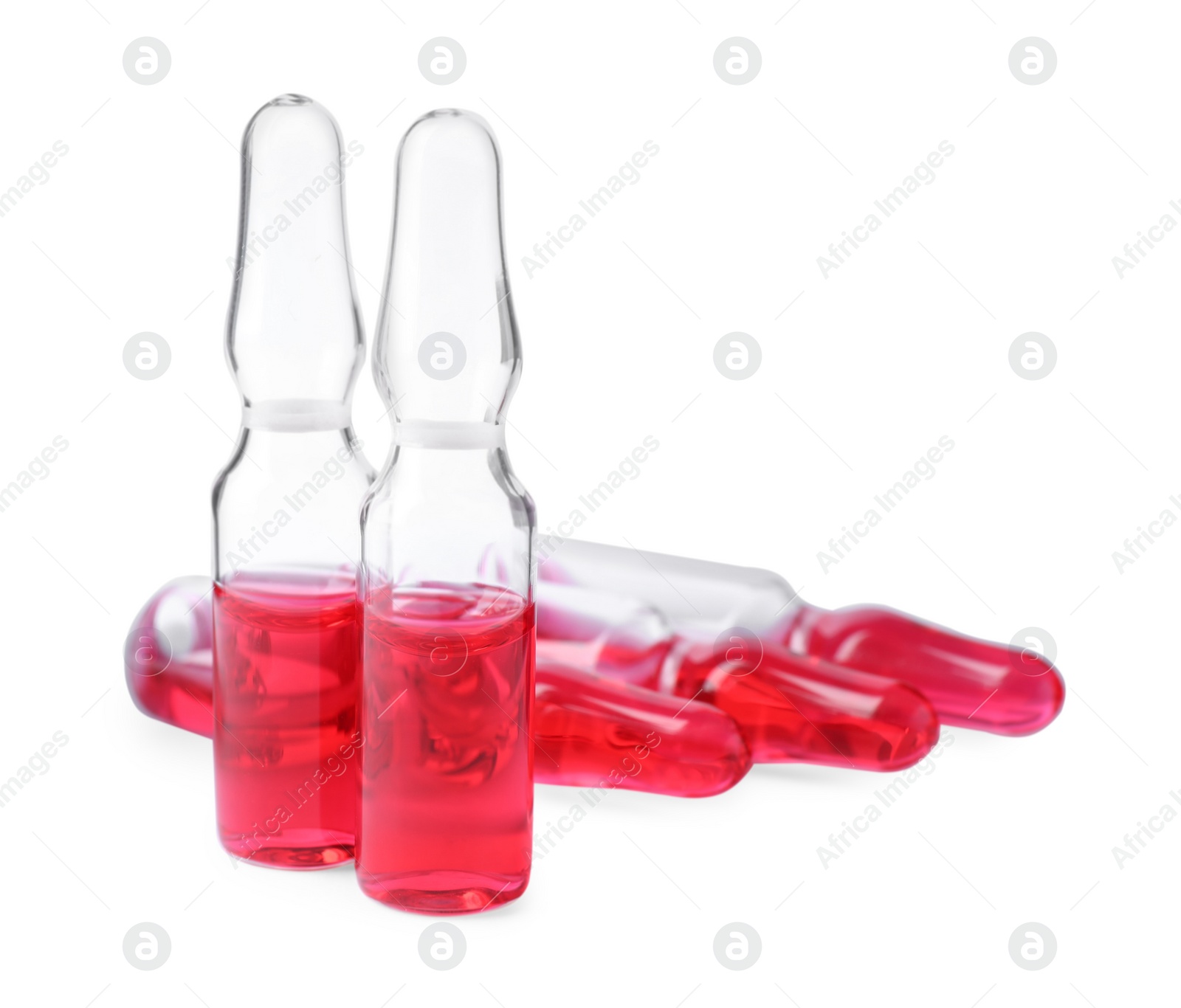 Photo of Pharmaceutical ampoules with medication on white background