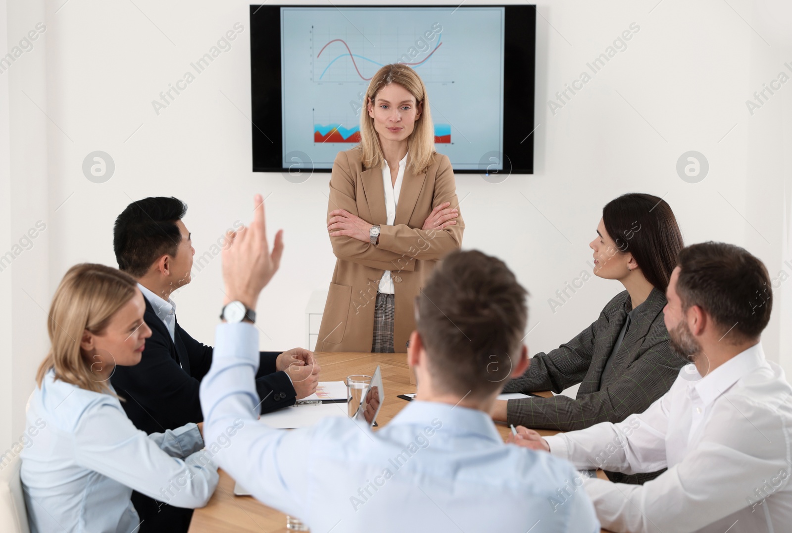 Photo of Businesswoman having meeting with her employees in office