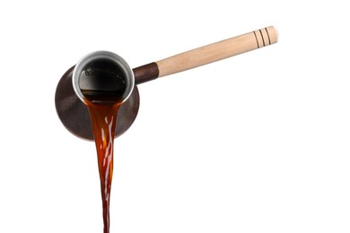 Photo of Pouring hot coffee from turkish pot on white background