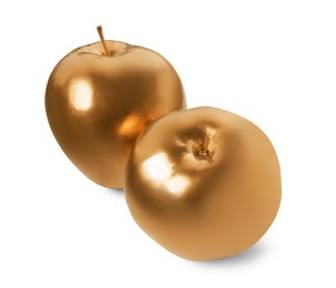Photo of Shiny stylish golden apples on white background