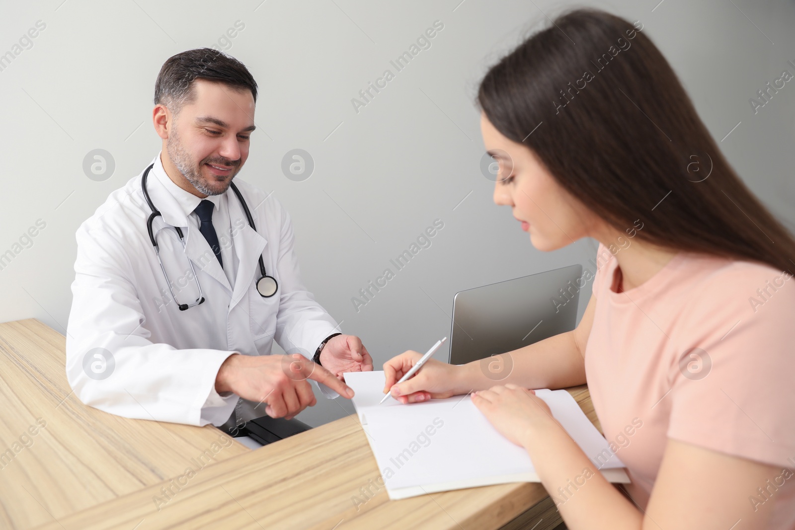 Photo of Patient having appointment with doctor in clinic