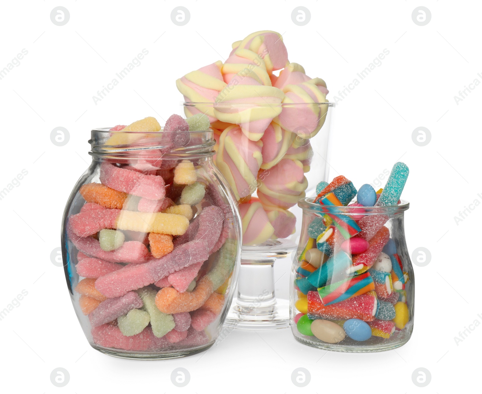 Photo of Glass jars and dessert bowl with different candies on white background