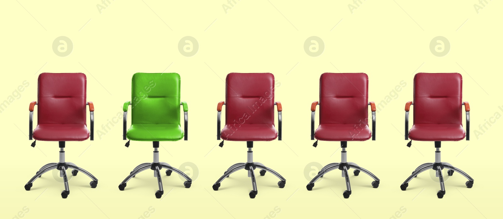 Image of Vacant position. Green office chair among red ones on beige background, banner design