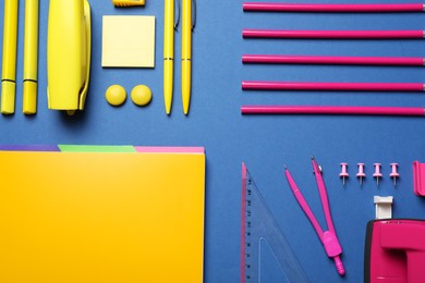 Flat lay composition with different stationery on blue background
