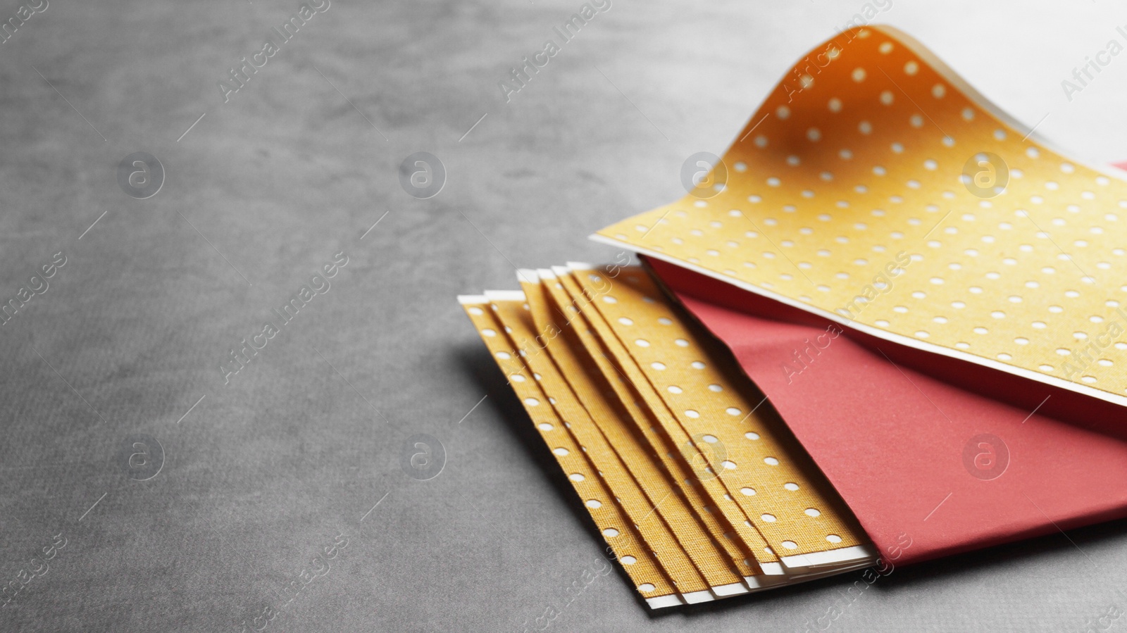 Photo of Pepper plasters on grey textured background, closeup. Space for text