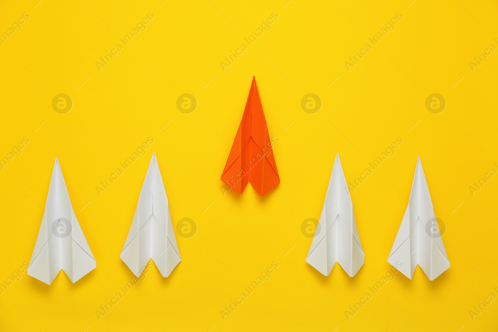 Photo of Flat lay composition with paper planes on yellow background