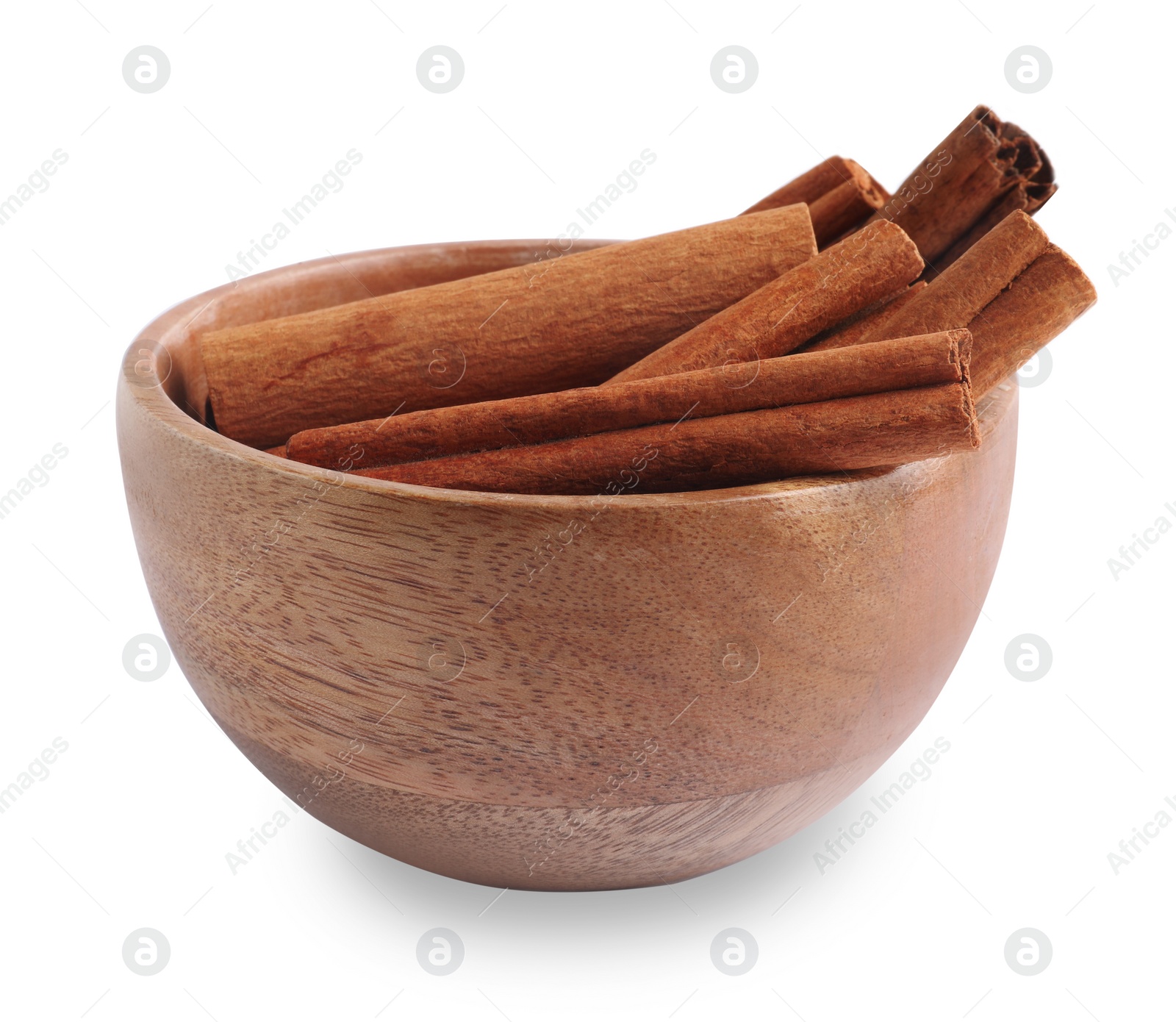 Photo of Aromatic cinnamon sticks in bowl isolated on white