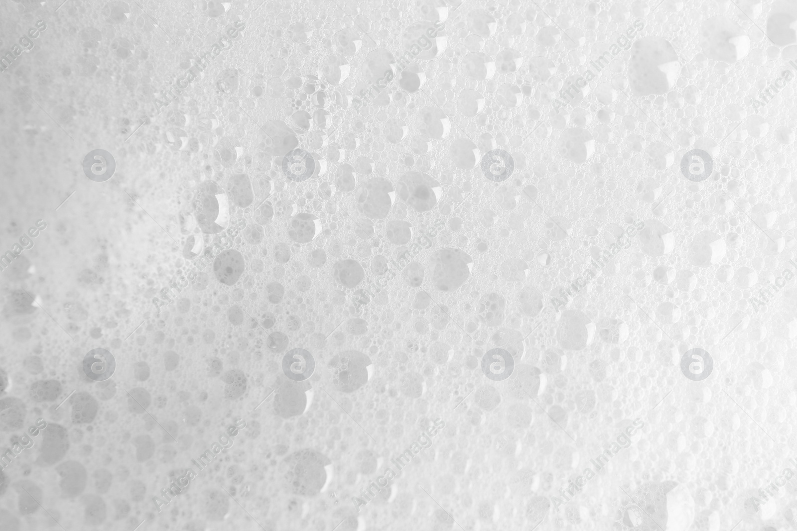 Photo of White fluffy foam as background, top view