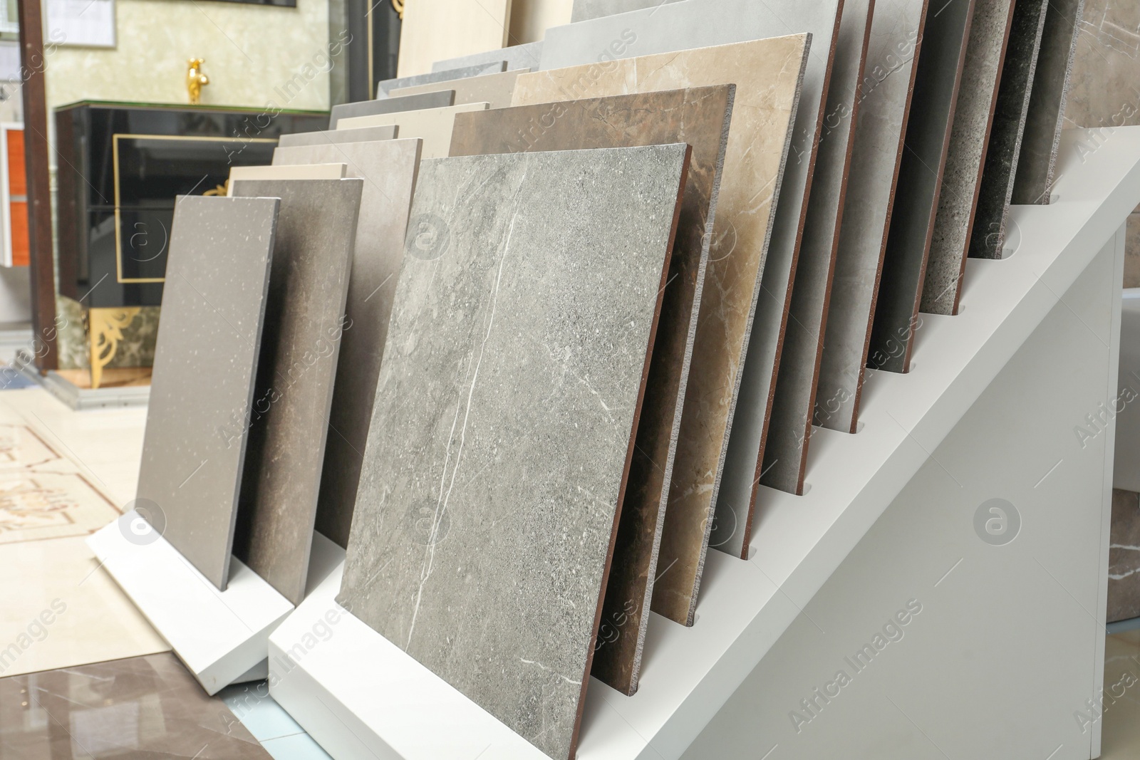 Photo of Many different samples of tiles on display in store