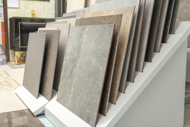 Photo of Many different samples of tiles on display in store
