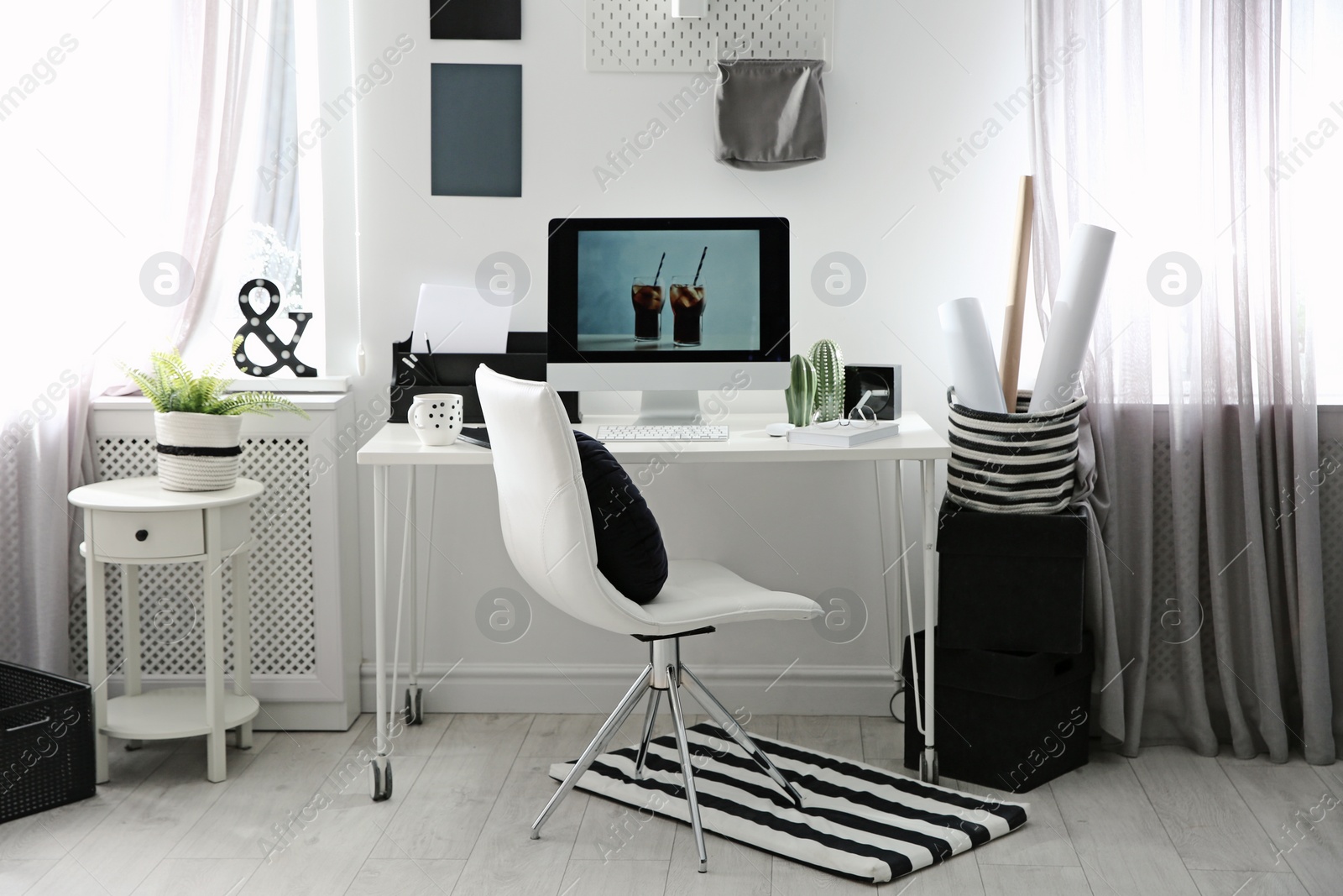 Photo of Comfortable workplace with computer on desk in home office