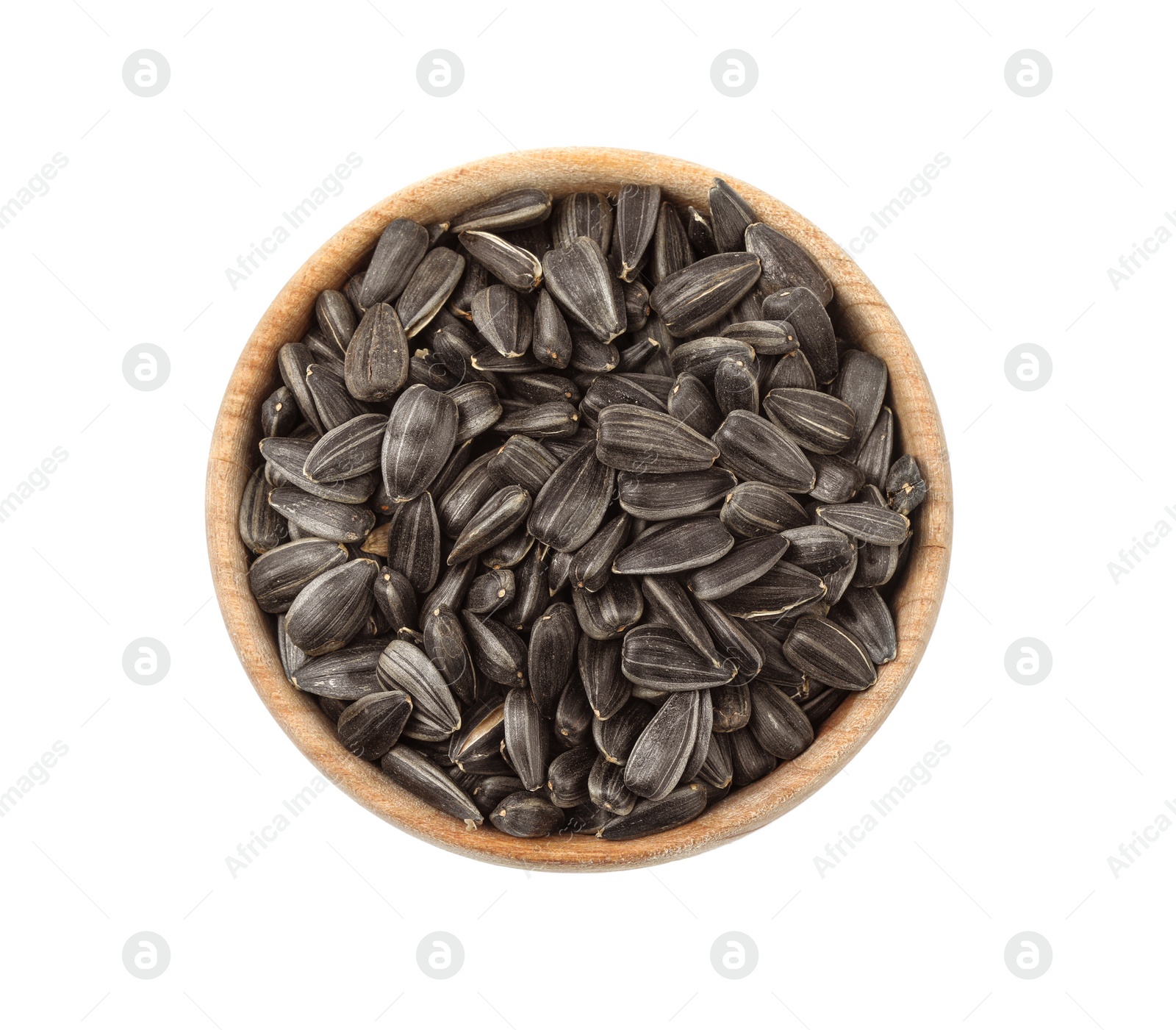 Photo of Raw organic sunflower seeds in wooden bowl isolated on white, top view