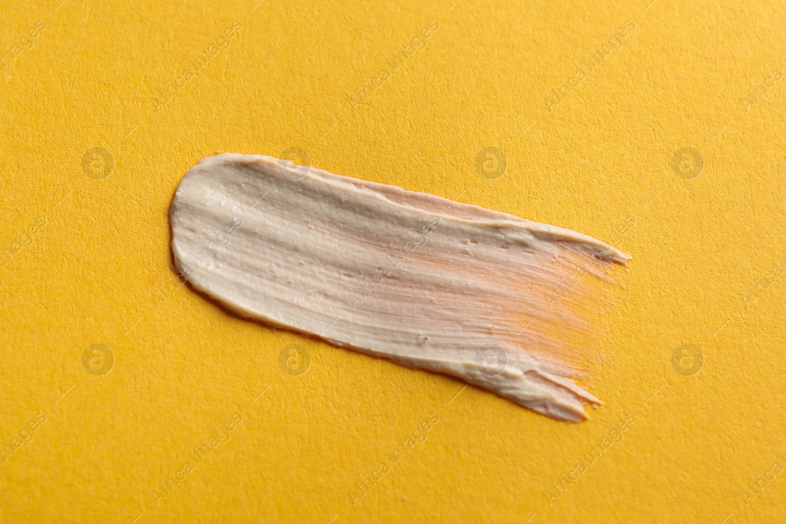 Photo of Sample of face mask on orange background, top view