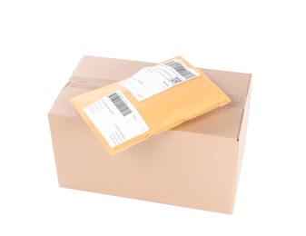 Padded envelope and cardboard parcel on white background