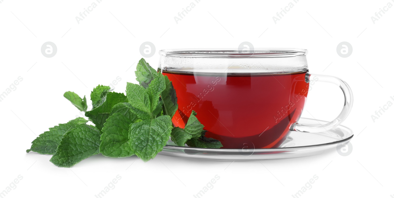 Photo of Cup with hot aromatic mint tea and fresh leaves isolated on white