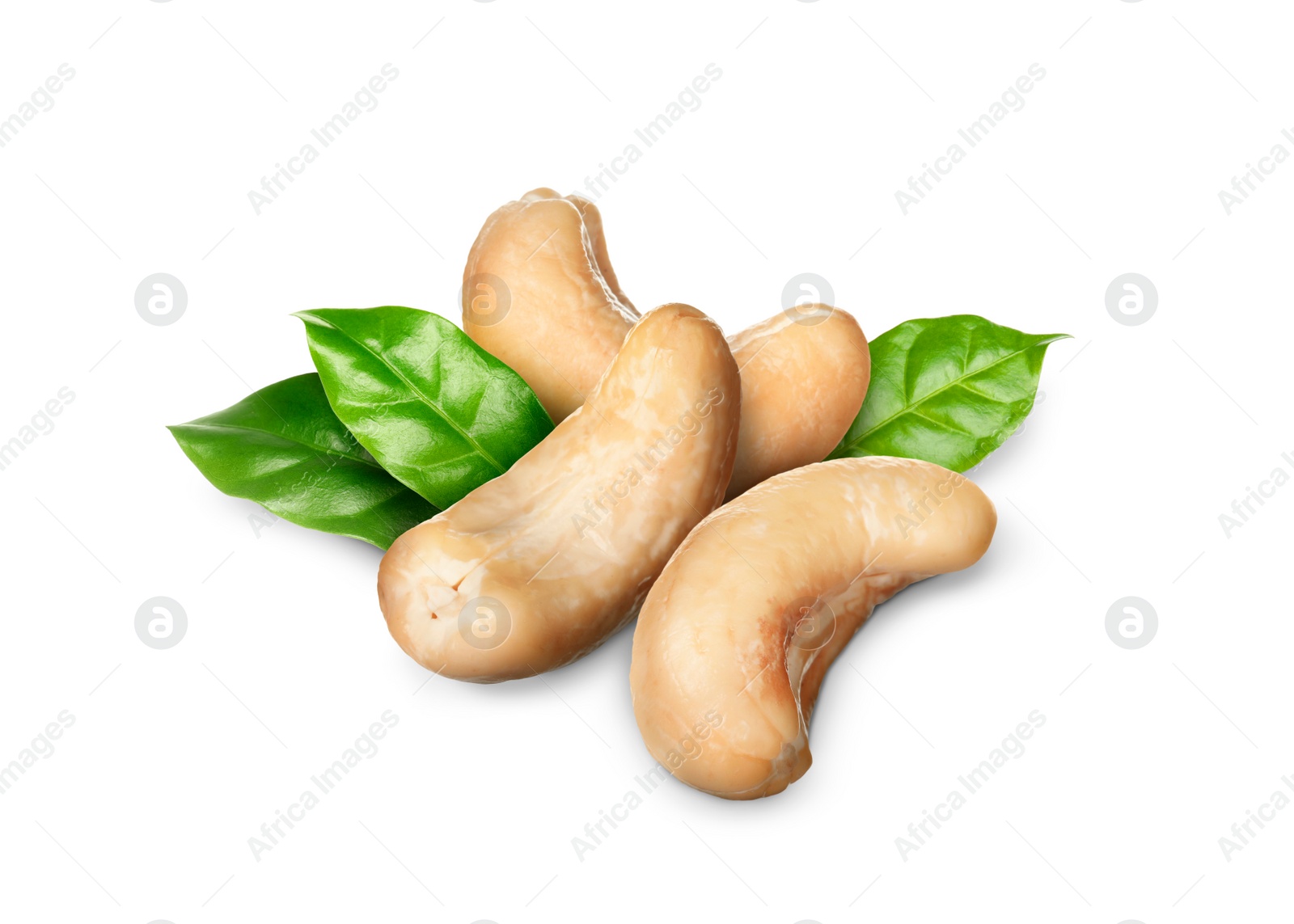 Image of Tasty cashew nuts and fresh green leaves on white background 