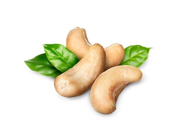 Image of Tasty cashew nuts and fresh green leaves on white background 