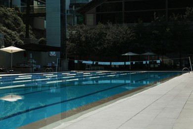 Photo of Outdoor swimming pool at luxury resort on sunny day