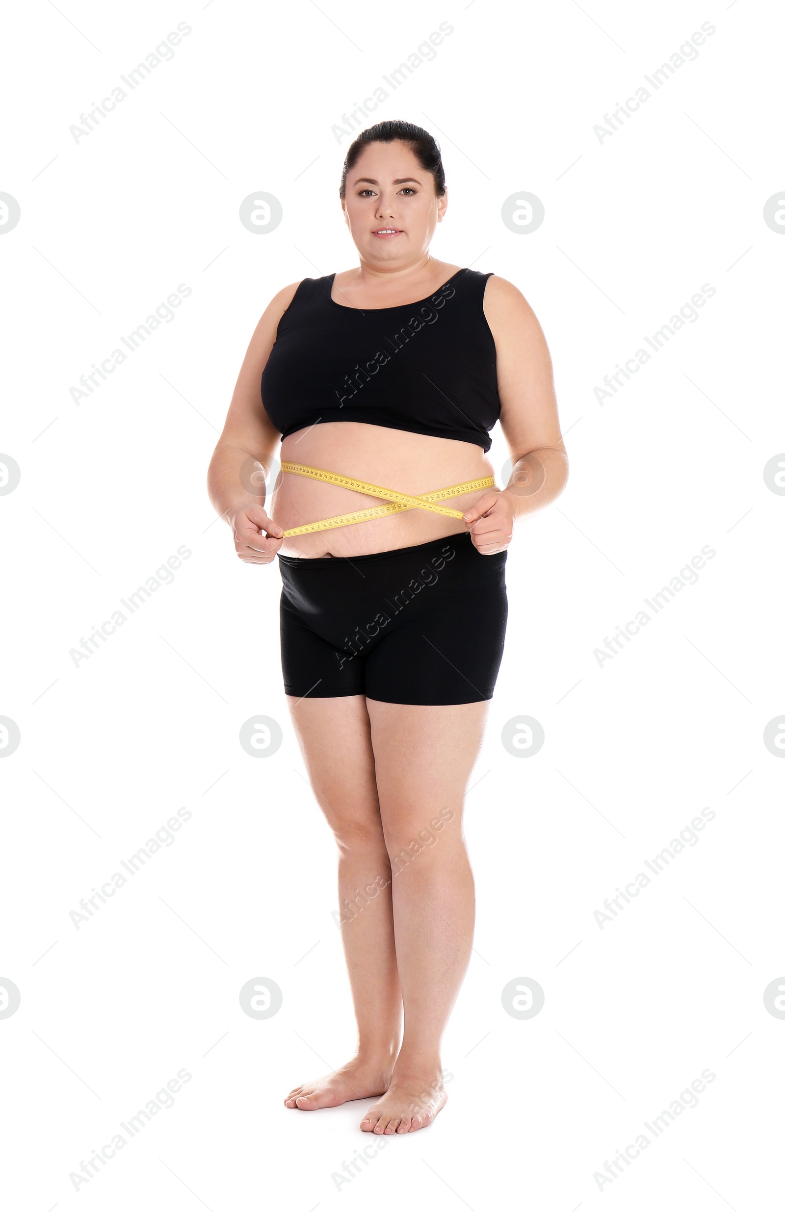 Photo of Full length portrait of fat woman with measuring tape on white background. Weight loss