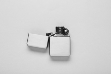Photo of Gray metallic cigarette lighter on white background, top view