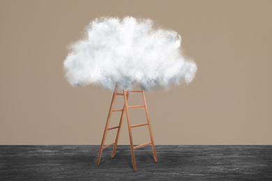 Image of Wooden ladder with cloud near brown wall. Conceptual design 