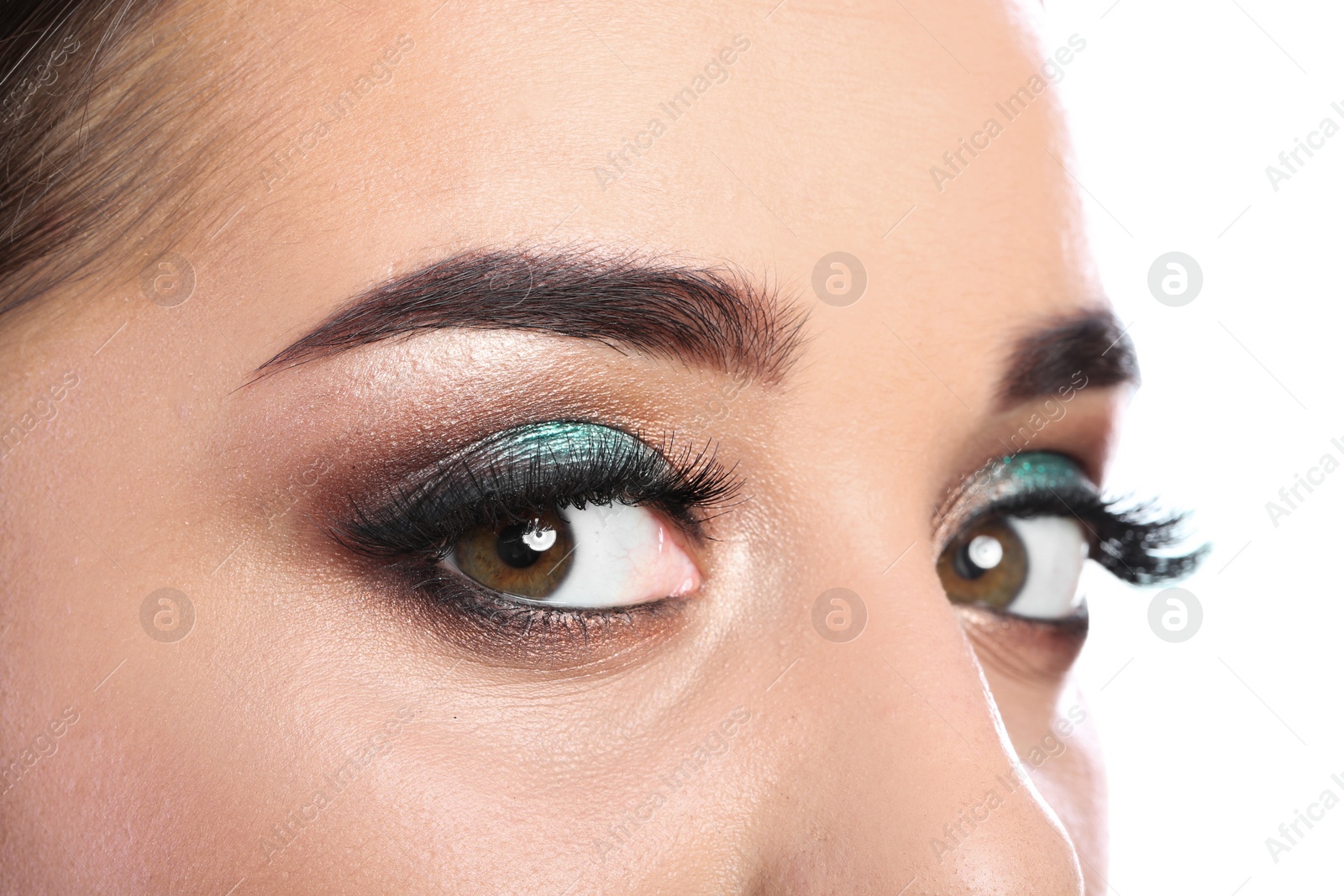 Photo of Young woman with eyelash extensions and beautiful makeup, closeup