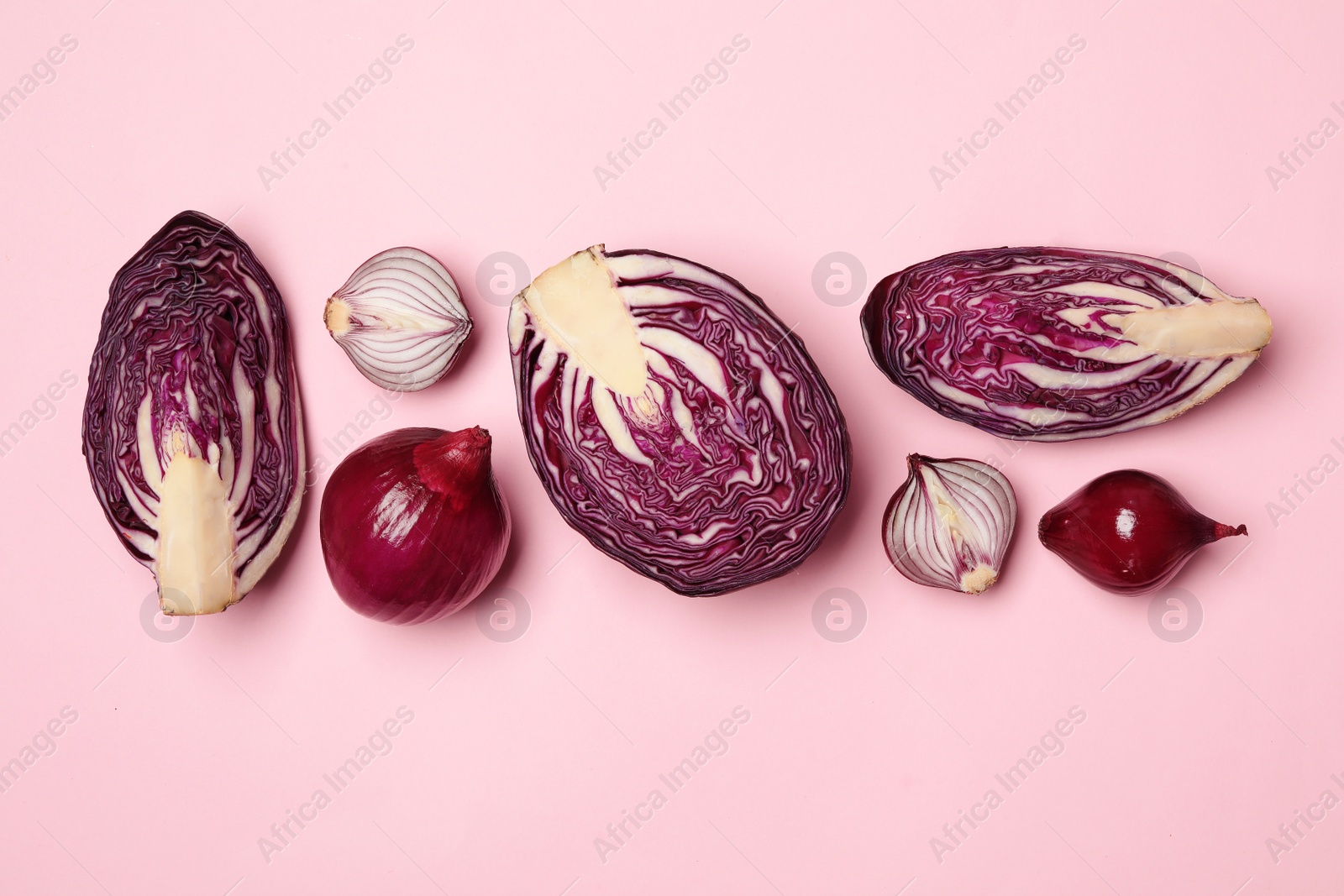 Photo of Flat lay composition with fresh ripe cabbages and onions on color background. Organic vegetables