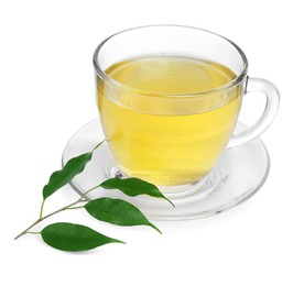 Photo of Fresh green tea in glass cup, leaves and saucer isolated on white