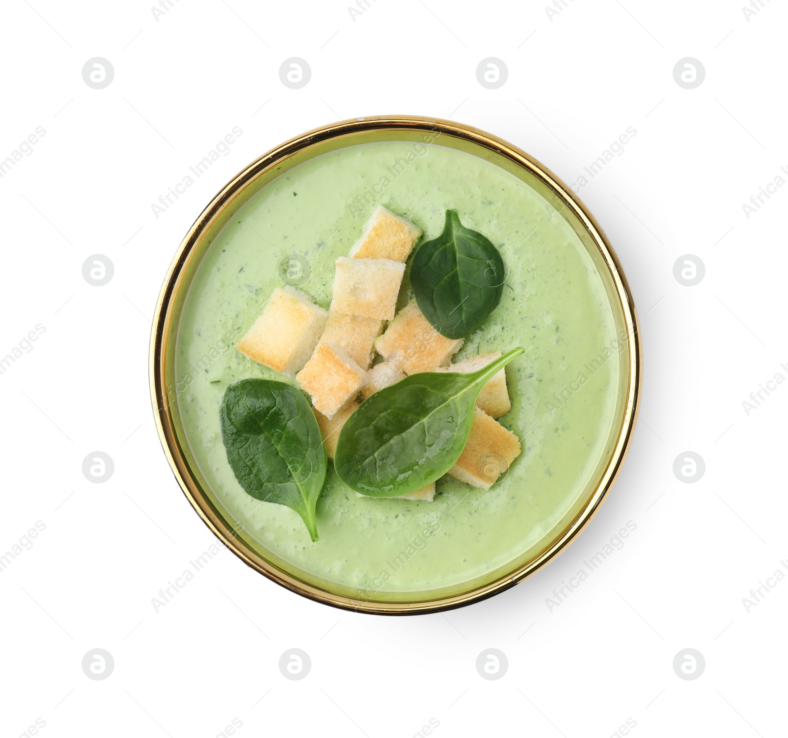 Photo of Delicious spinach cream soup with croutons in bowl isolated on white, top view