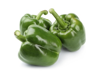 Photo of Ripe green bell peppers on white background