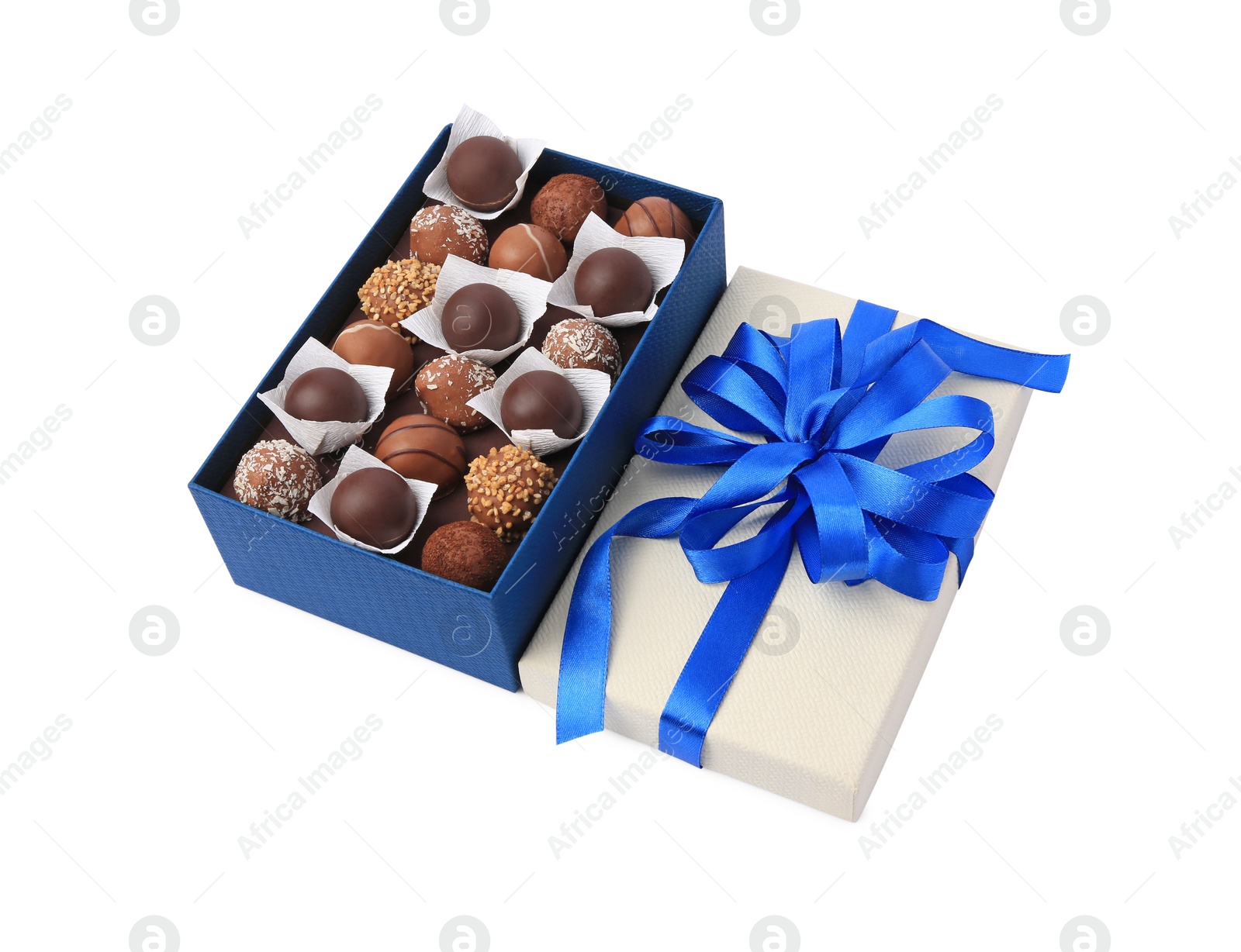 Photo of Box with delicious chocolate candies isolated on white