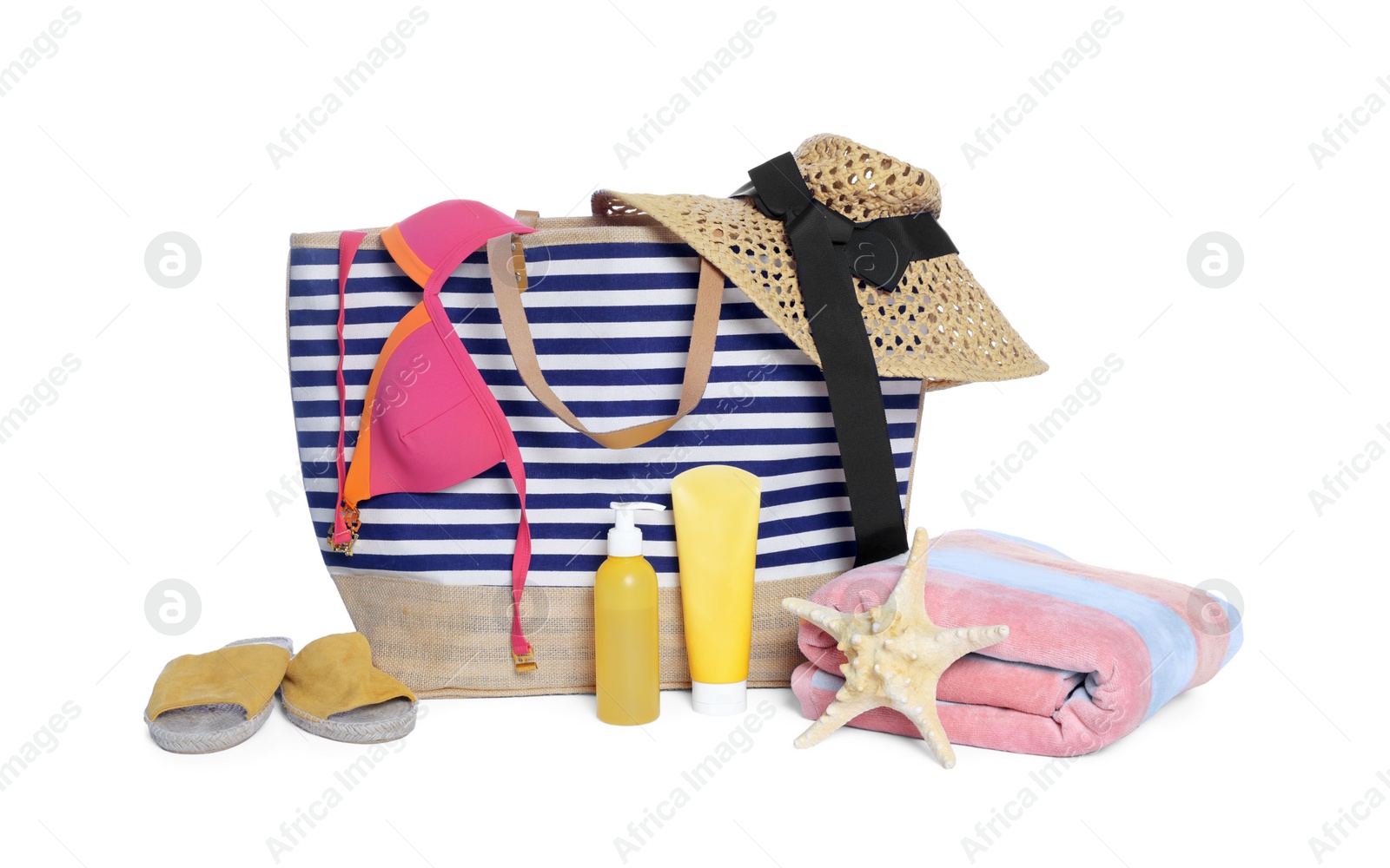 Photo of Stylish bag, starfish and other beach accessories isolated on white