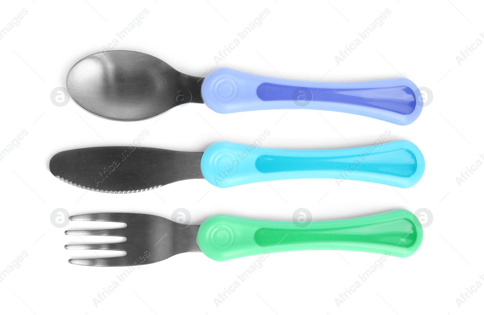 Photo of Set of small cutlery isolated on white, top view. Serving baby food