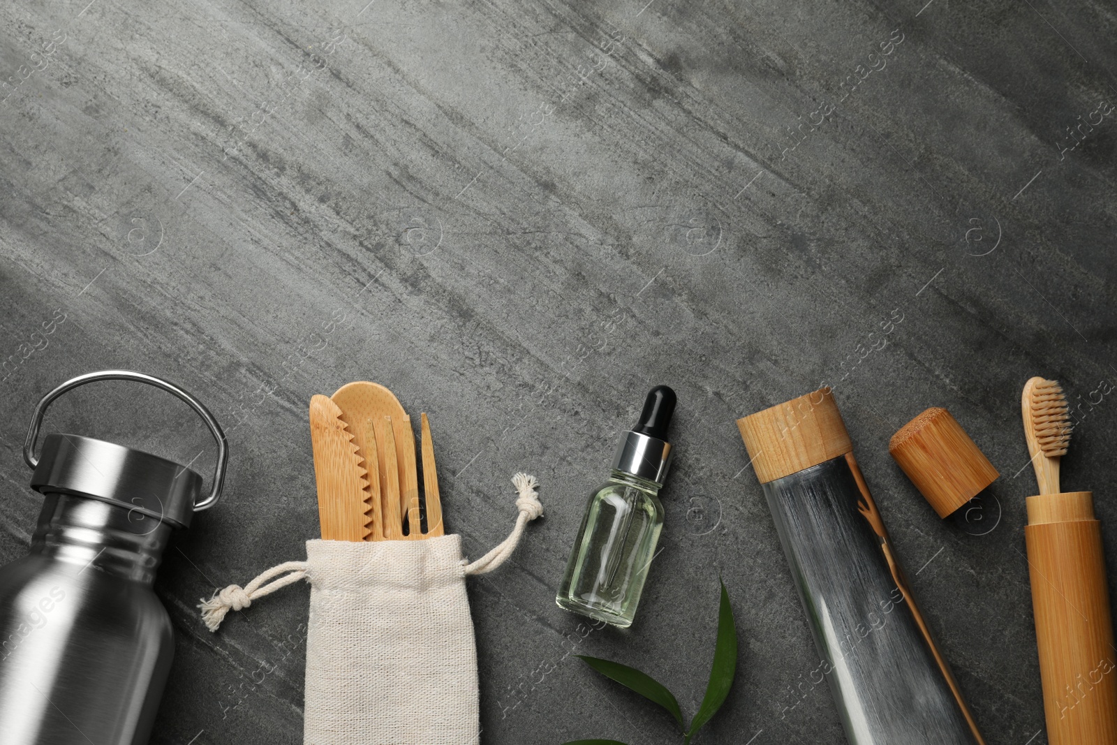 Photo of Flat lay composition with eco friendly products on grey background, space for text. Conscious consumption